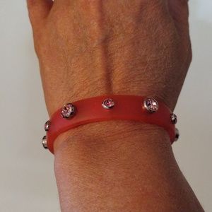 Beautiful rubber bracelet with rhinestone studs.